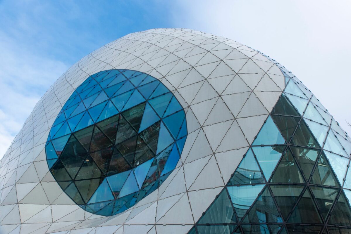 Striking architecture of a modern dome in Eindhoven, showcasing geometric glass patterns.